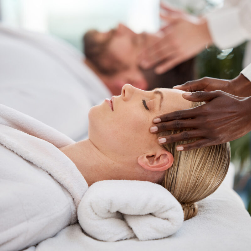 Shot of a couple getting a message in a spa during their wellness service session.