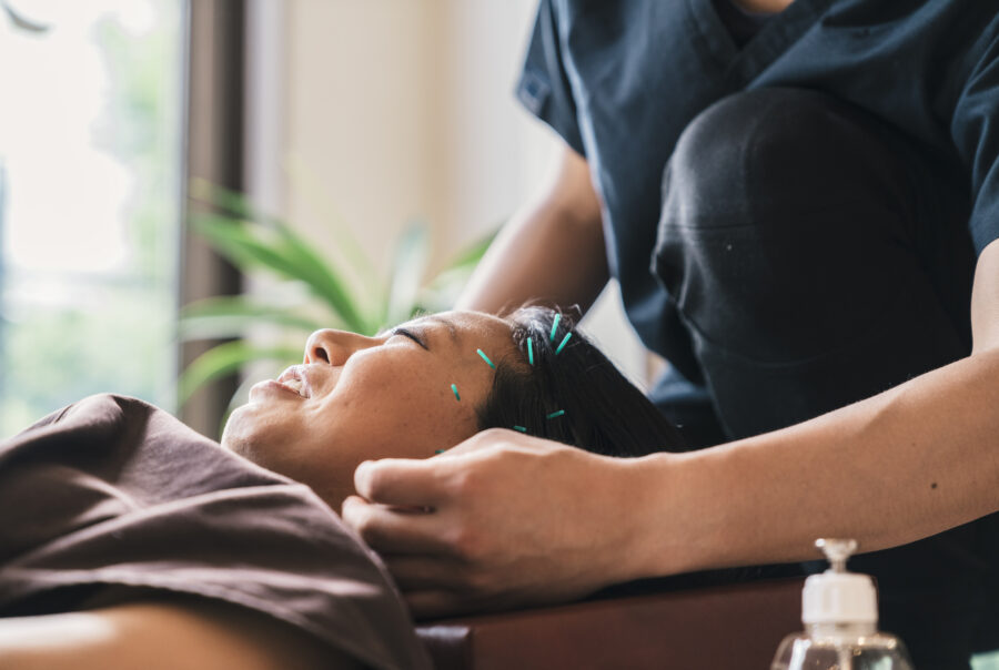 Therapist Giving Cupping Treatment To Young Asian Woman Manual Lymphatic Drainage