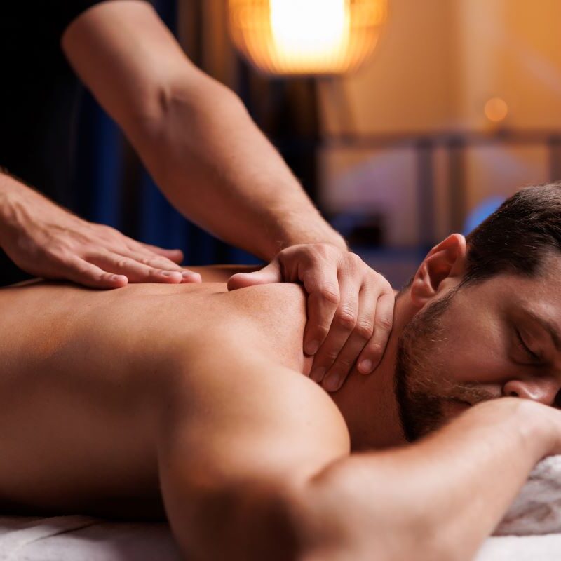 Man relaxing during a back massage session.