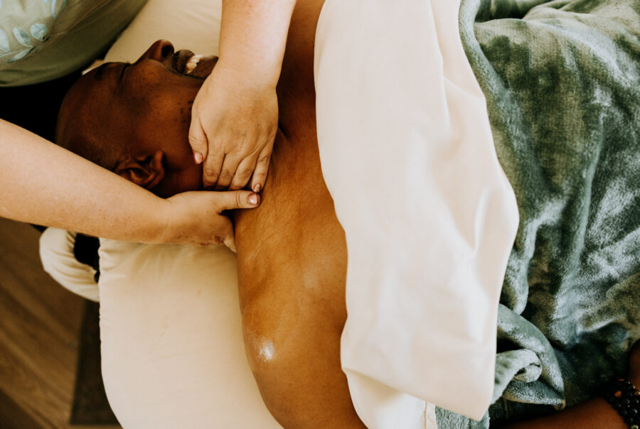 Person receiving relaxing back massage therapy.